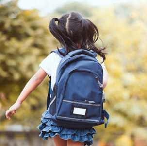 Back to school. Cute asian child girl with backpack running and going to school with fun